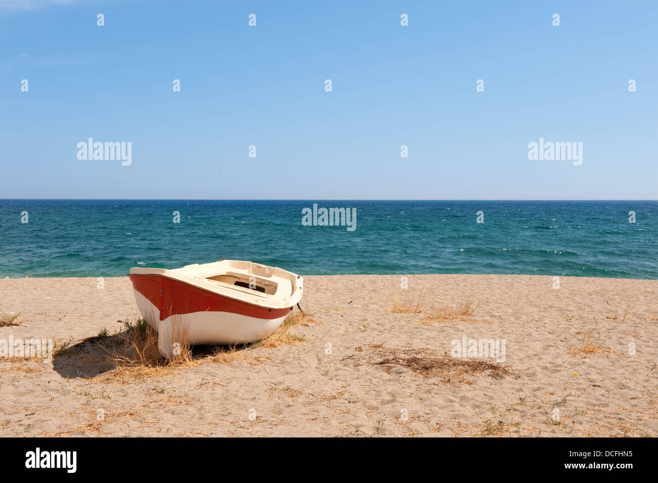 Boat on the tranquil beach Stock Photo