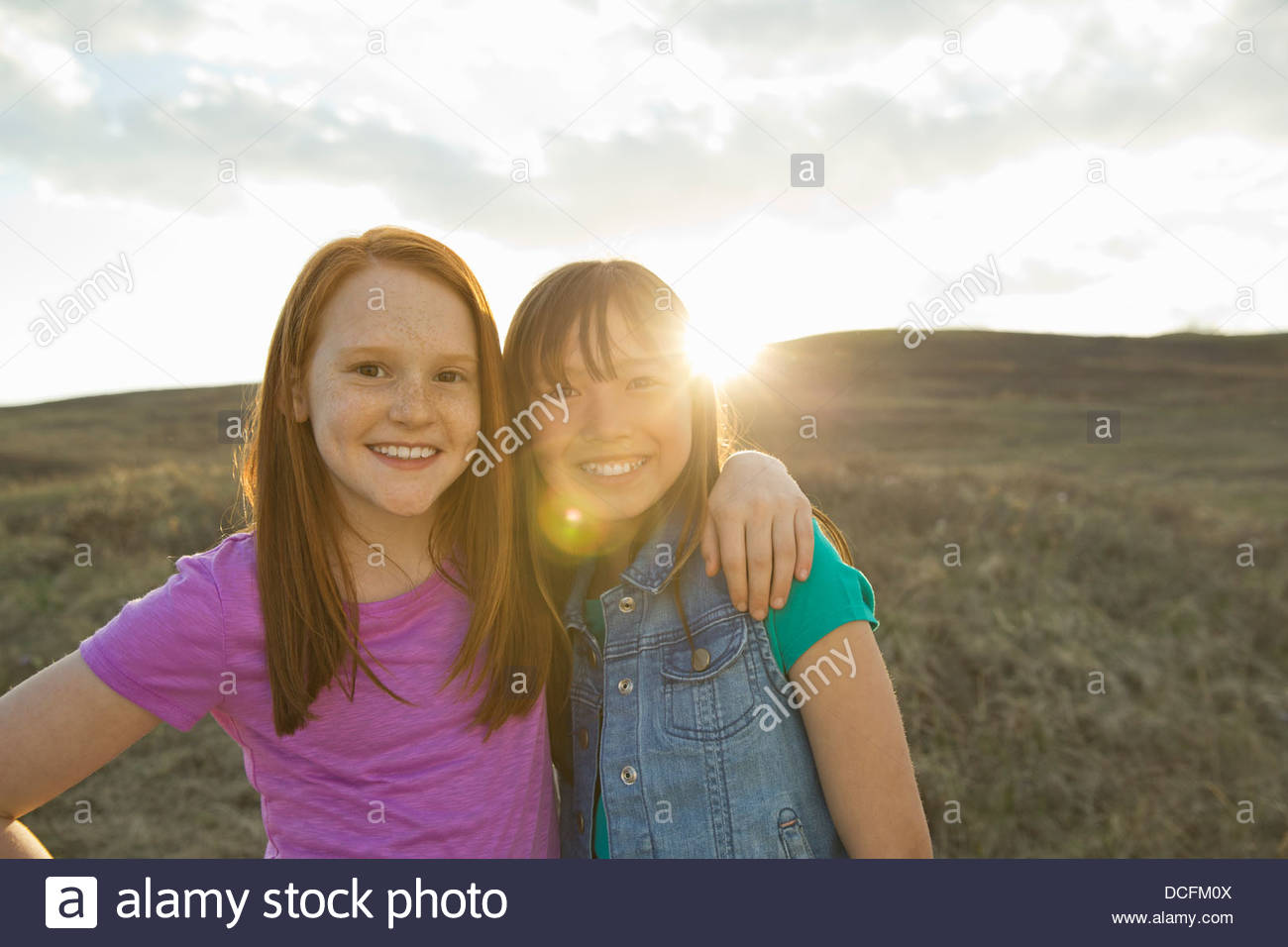 Children arms around each other hi-res stock photography and images - Alamy