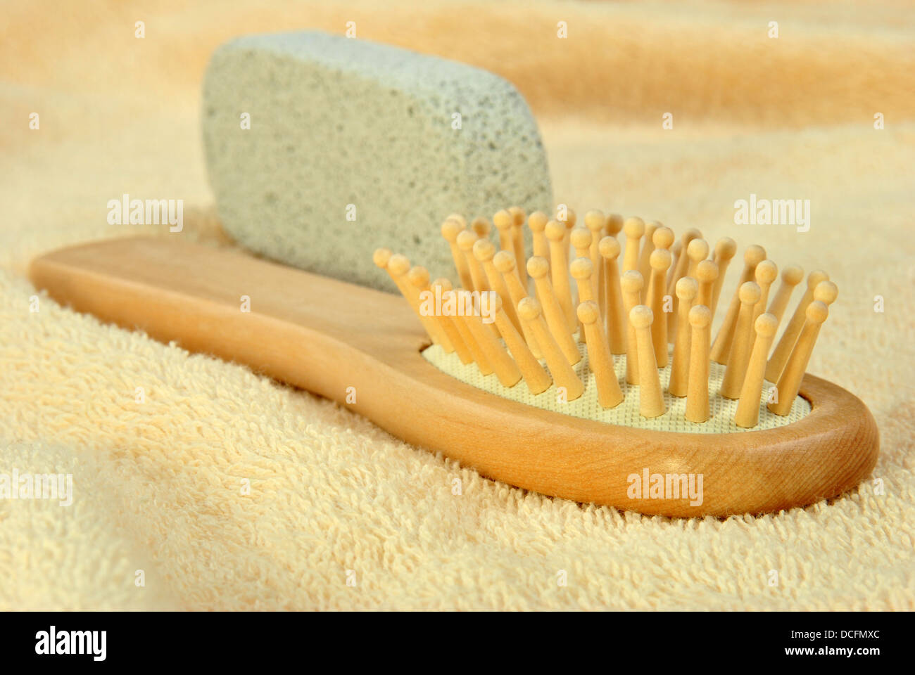 hair brush on a terry cloth towel and pumice Stock Photo