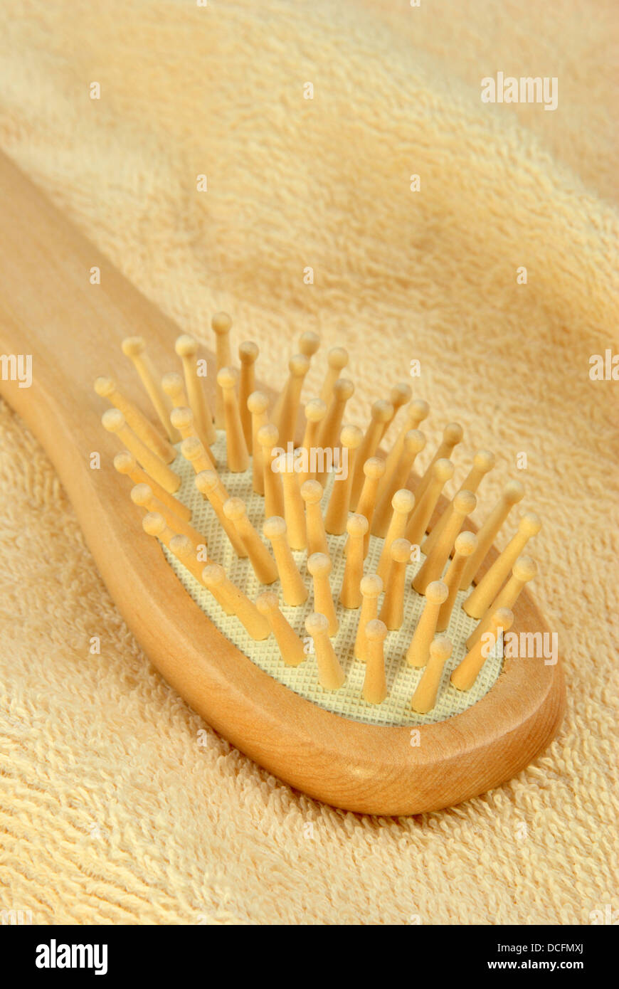 new hair brush on a terry cloth towel Stock Photo