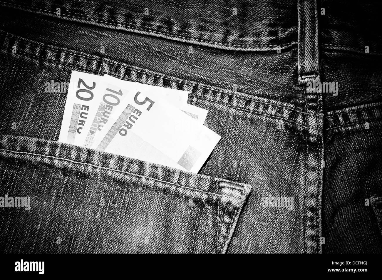 Foreign money in back pocket Stock Photo