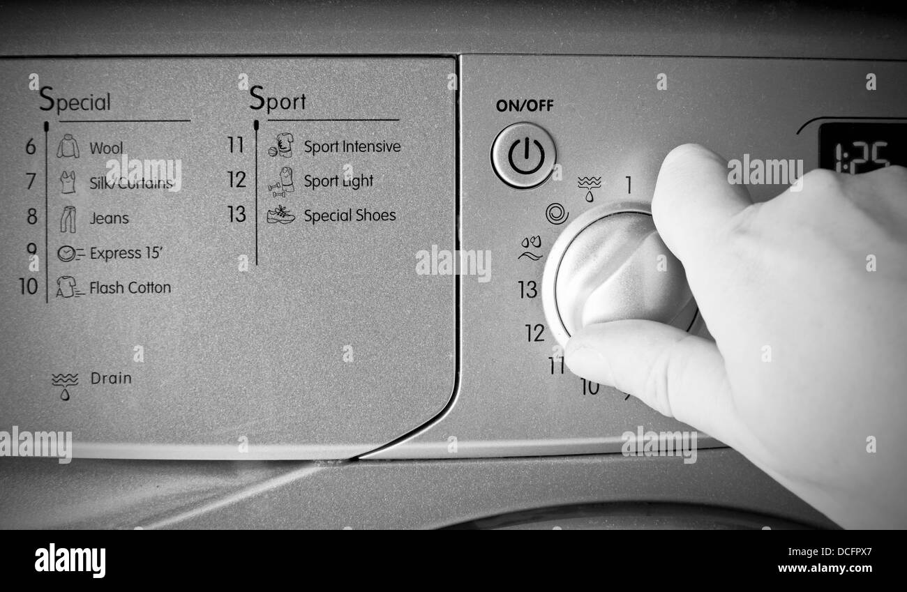 Using a washing machine Stock Photo Alamy