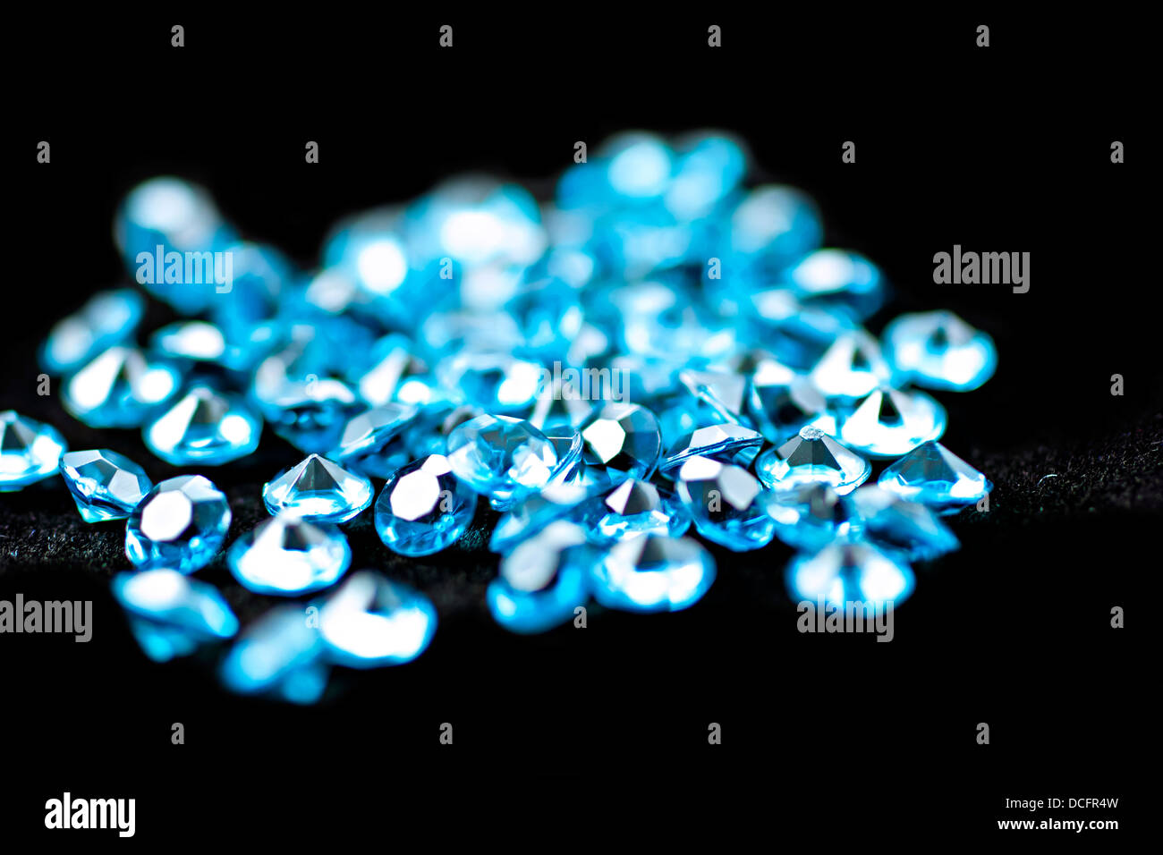 A scattering of various diamonds. Abstract background. Uncut gems