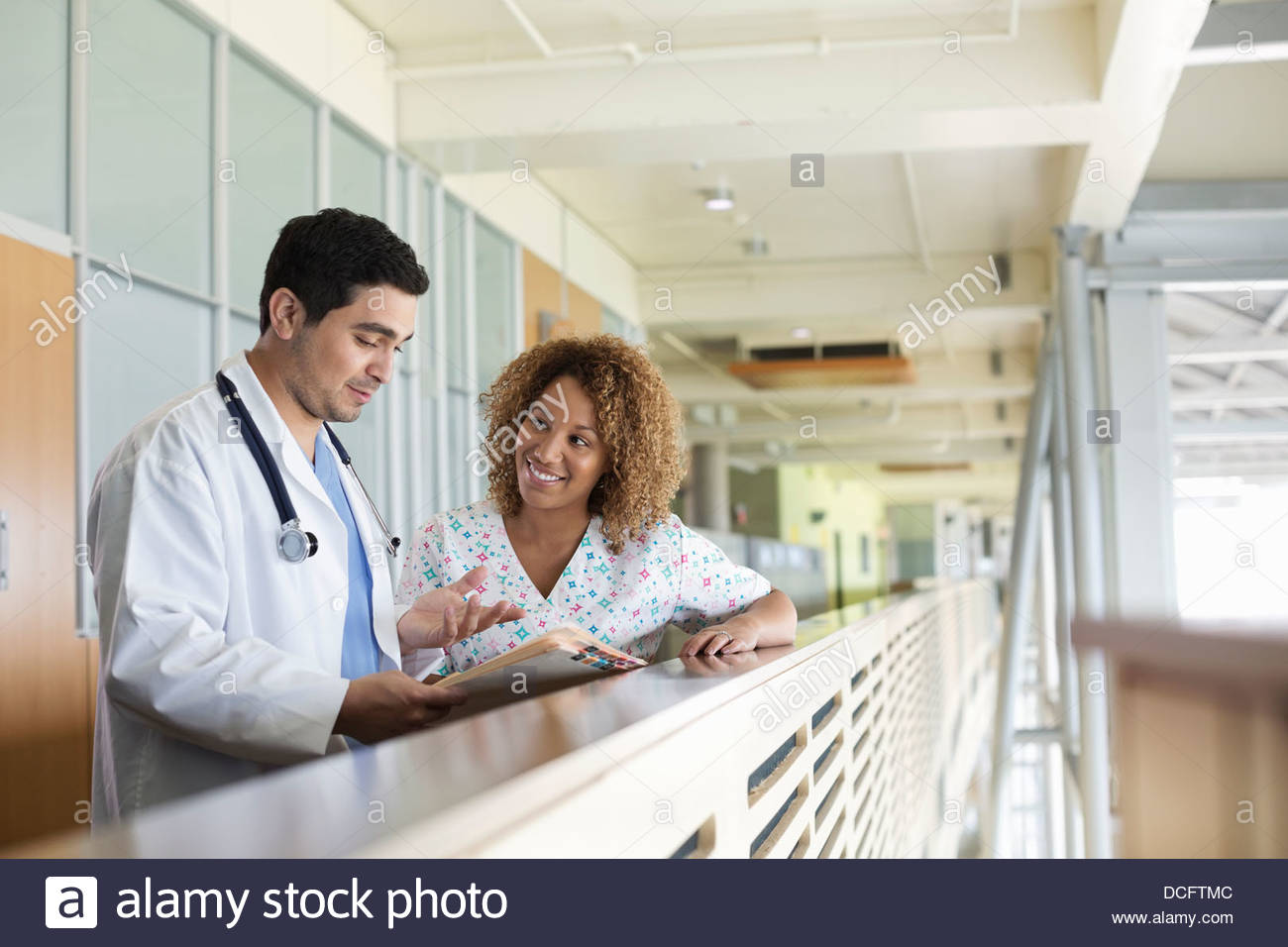 Medical professionals discussing patient information Stock Photo