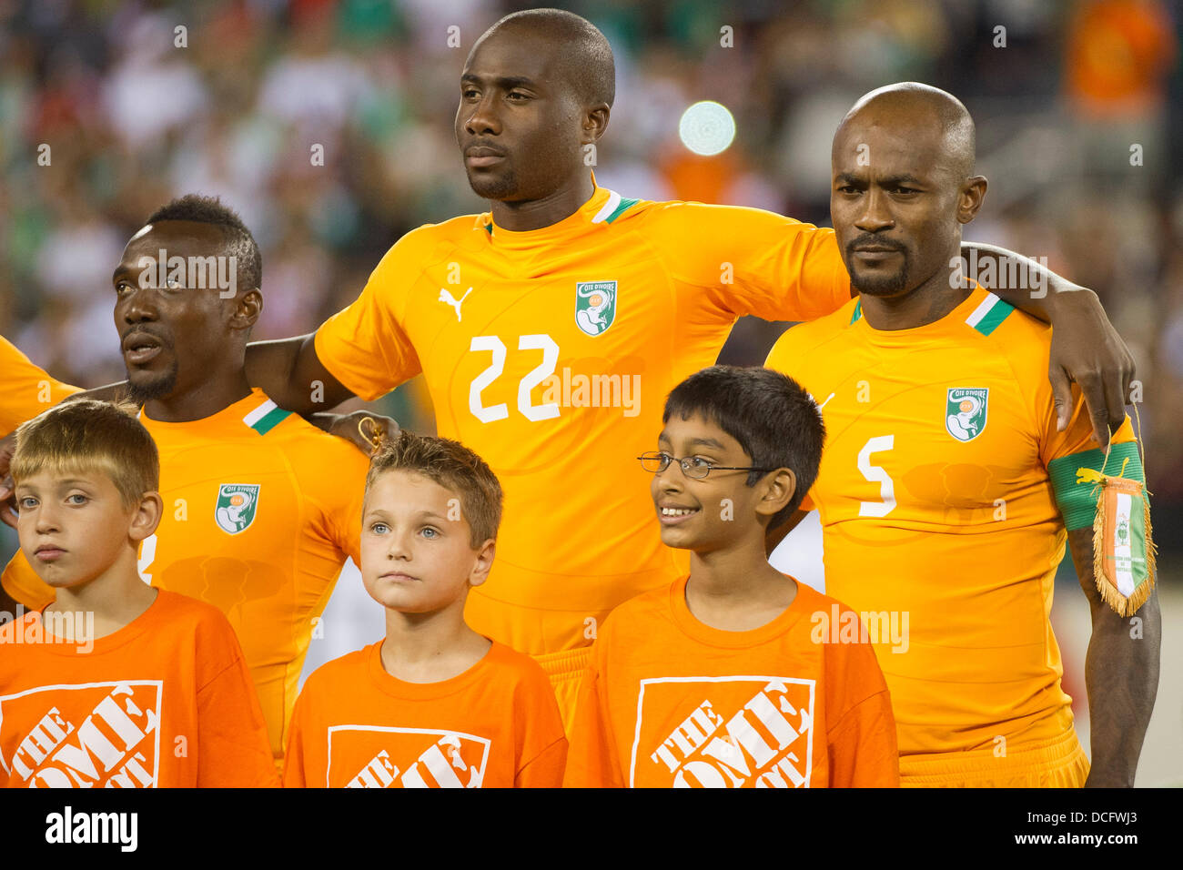 Aug. 14, 2013 - East Rutherford, New Jersey, U.S - August 14, 2013: Ivory Coast National Team Souleman Bamba defender (22) and Ivory Coast National Team defender Didier Zokora (5) stand for the National Anthem during the International friendly match between Mexico and Ivory Coast at Met Life Stadium, East Rutherford, NJ. Mexico defeated Ivory Coast 4-1. Stock Photo