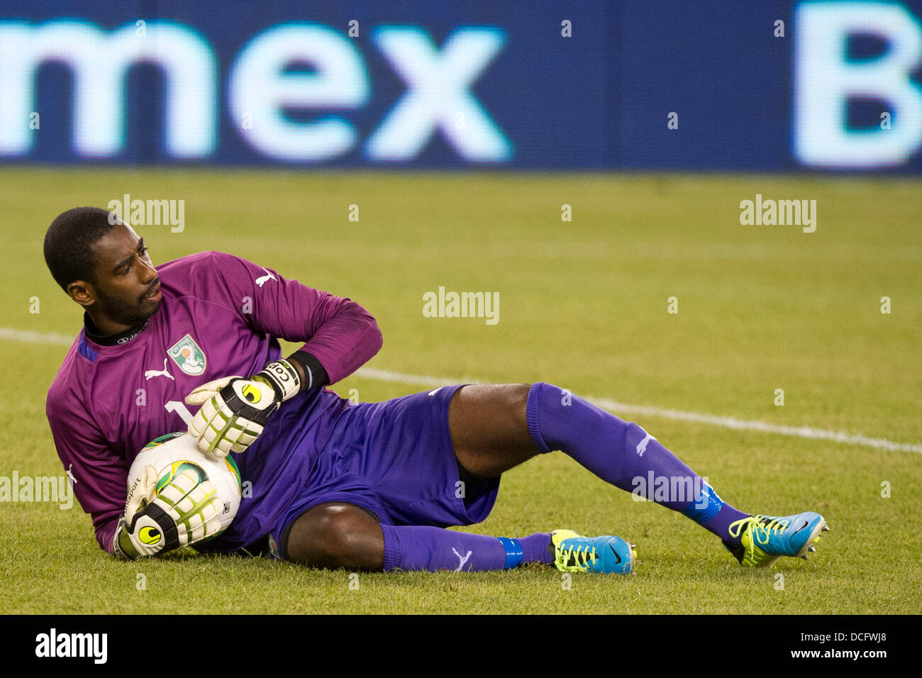 Aug. 14, 2013 - East Rutherford, New Jersey, U.S - August 14, 2013: Ivory Coast National Team goalkeeper Boubacar Barry (1) lays on the ground holding the ball after a save during the International friendly match between Mexico and Ivory Coast at Met Life Stadium, East Rutherford, NJ. Mexico defeated Ivory Coast 4-1. Stock Photo