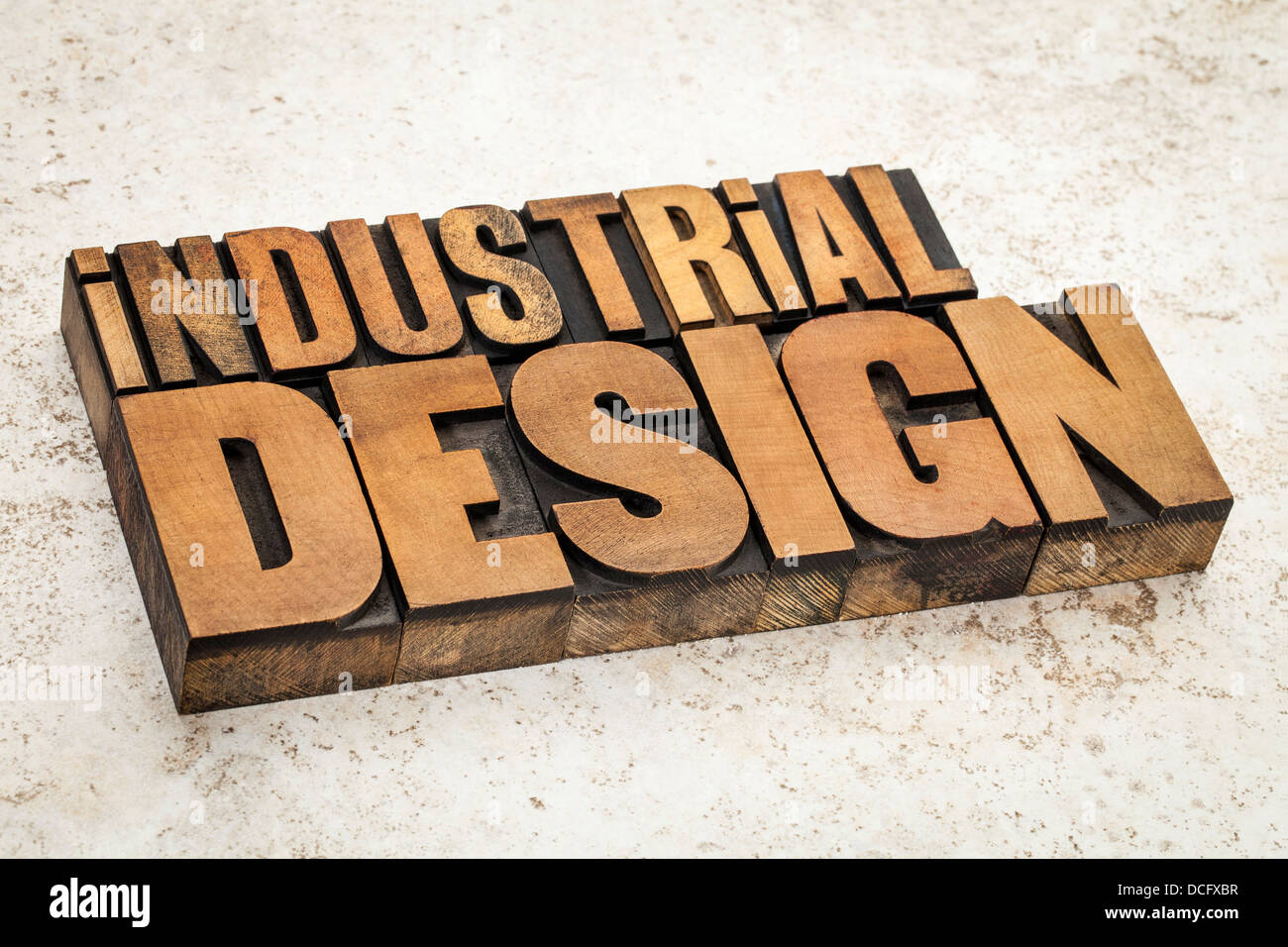 industrial design text in vintage letterpress wood type on a ceramic