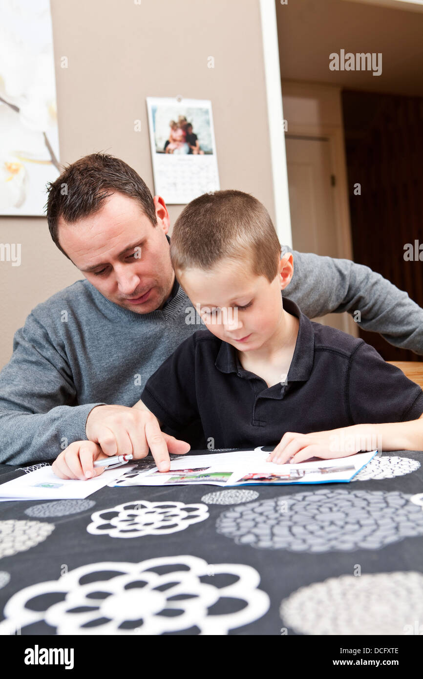Father helping son with homework Stock Photo - Alamy