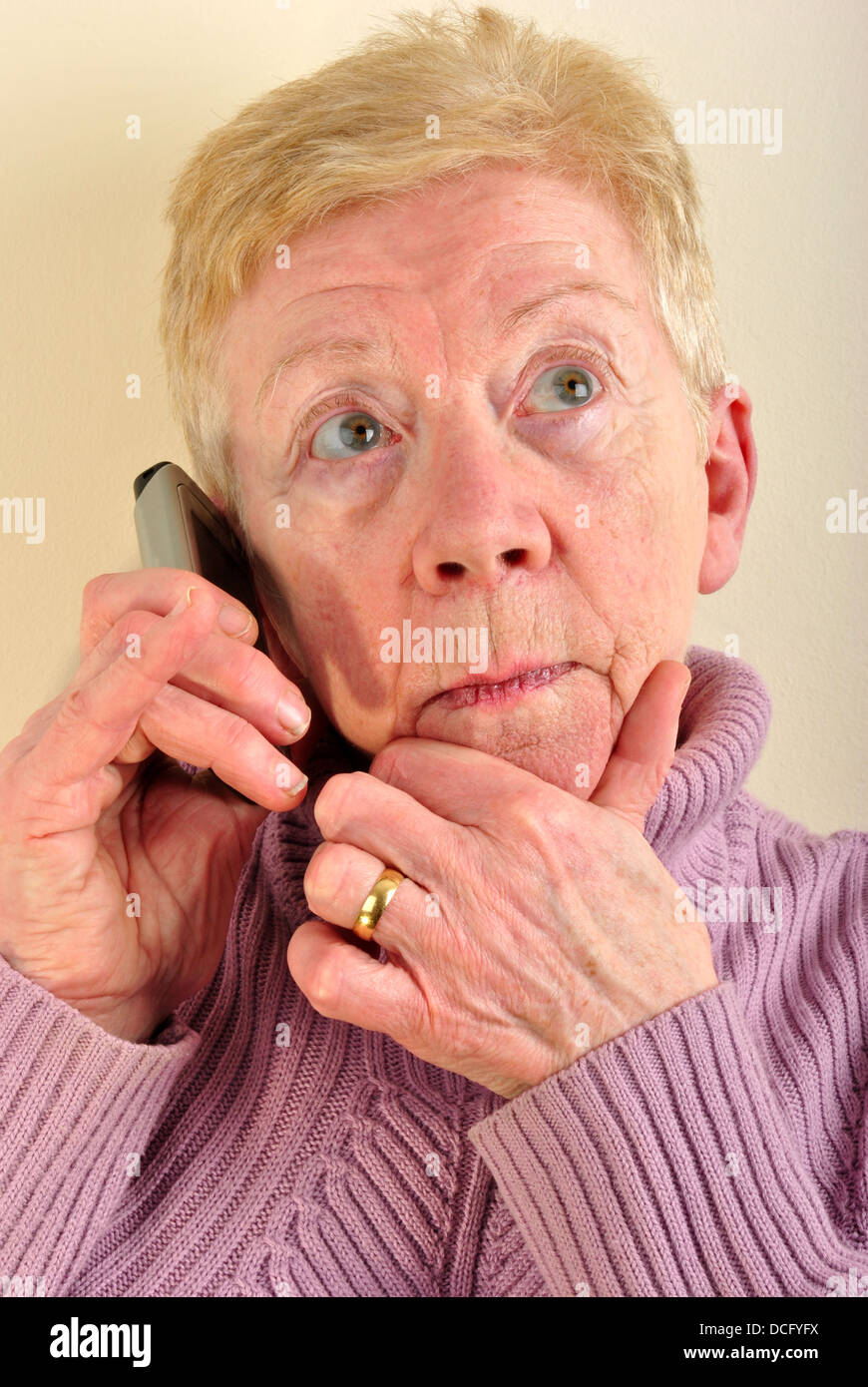 one old woman is talking on a telephone Stock Photo - Alamy