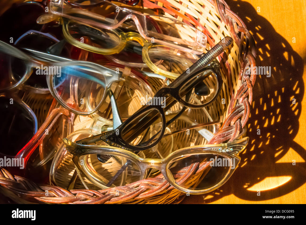 Vintage glasses and sunglasses in a basket Stock Photo