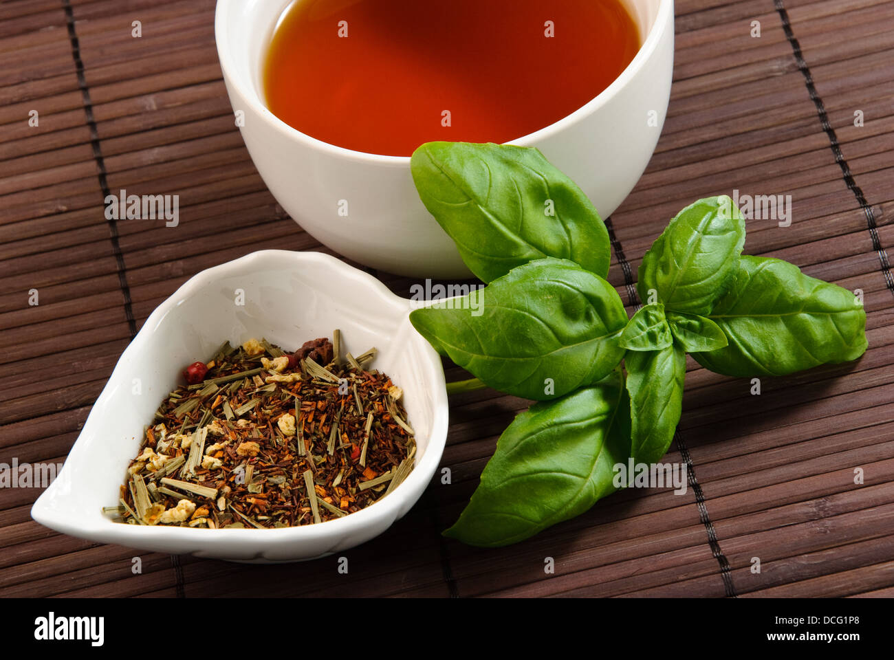 close up of cup of tea with tea leaves Stock Photo