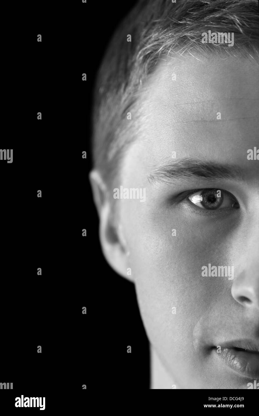 portrait of young attractive man, half face visible Stock Photo Alamy