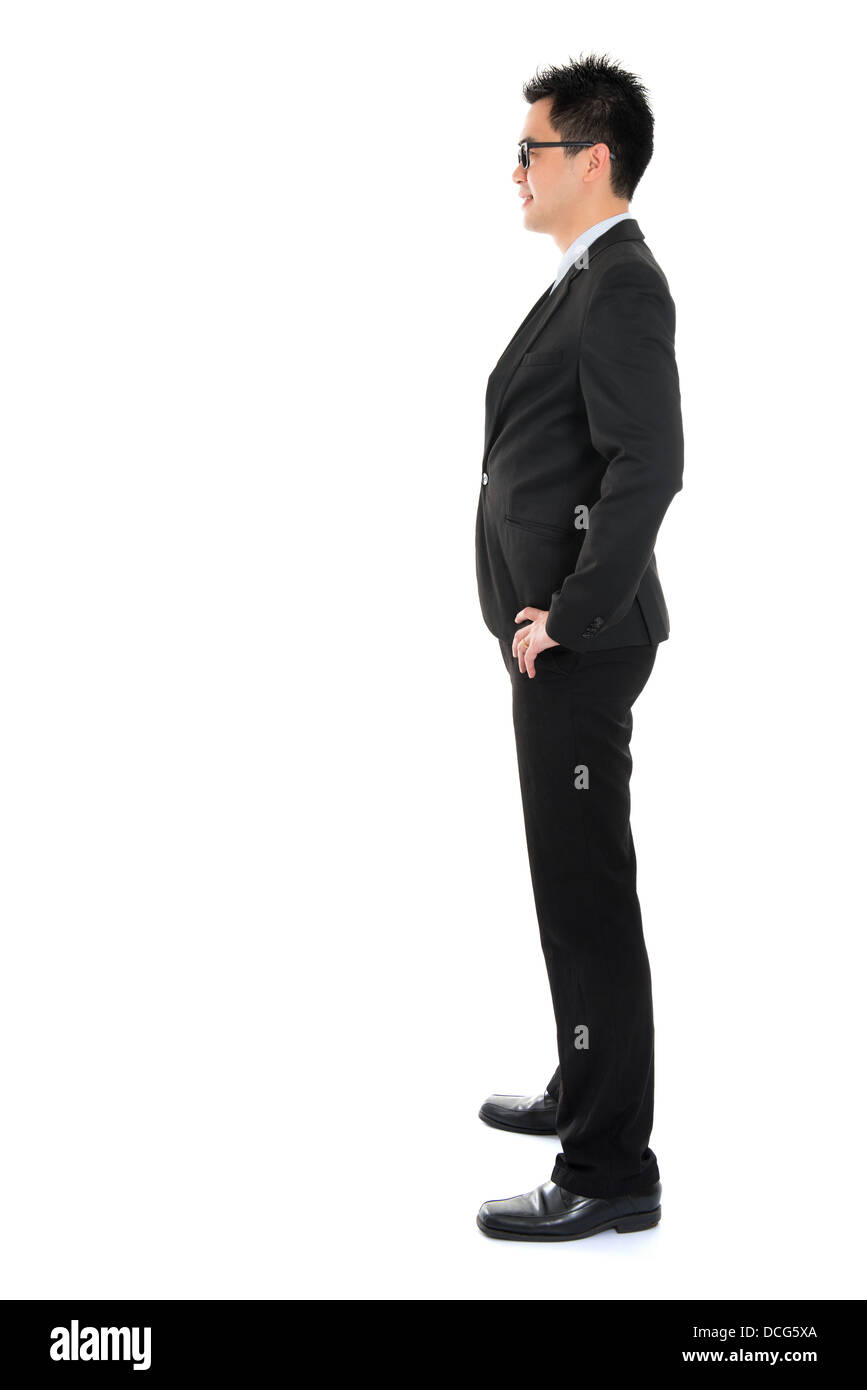 Man in suit standing side on full body hires stock photography and