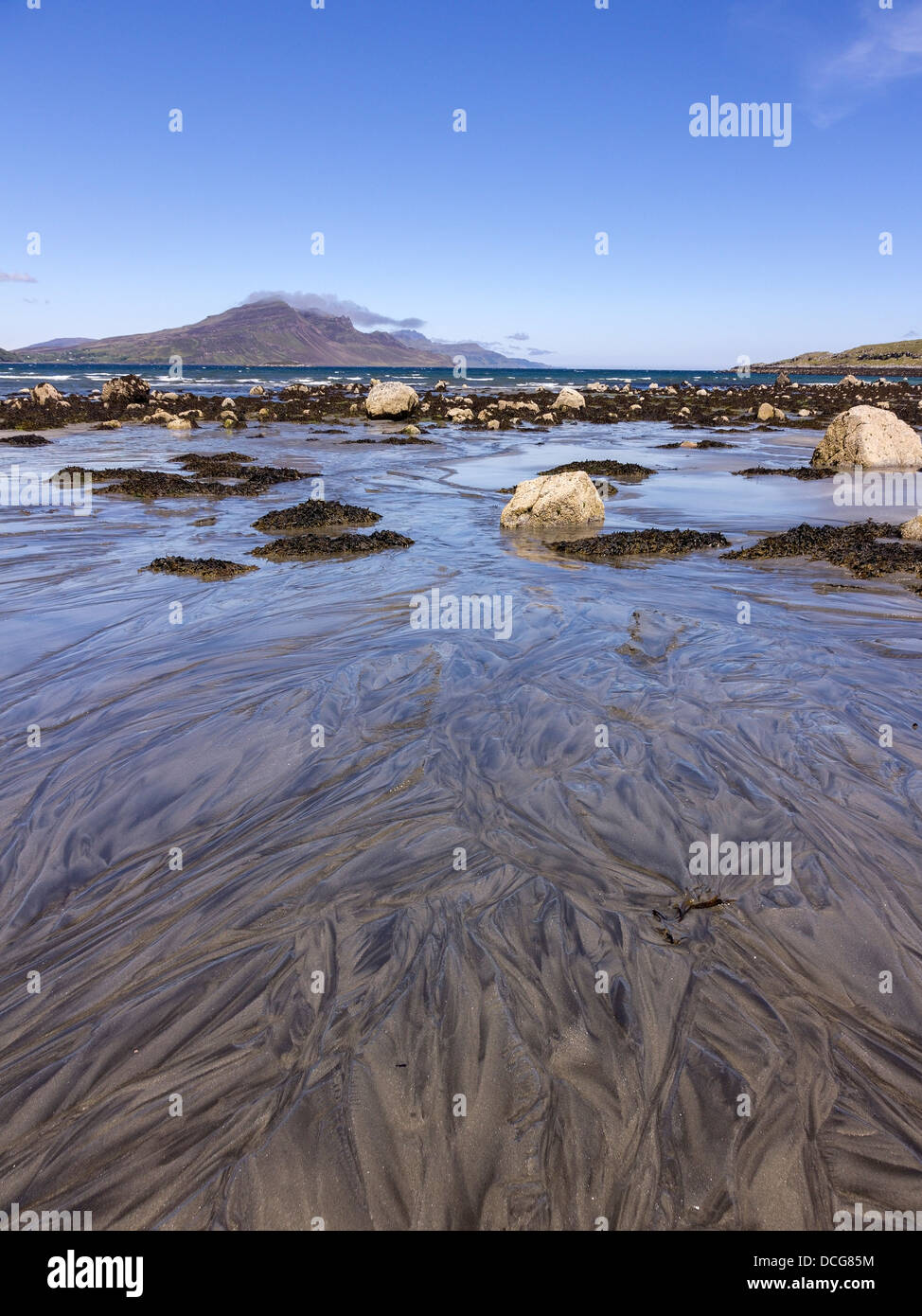 Patterned sands on Camas a Mhor-bheoil beach with mountains of Trotternish ridge beyond, The Braes, Isle of Skye, Scotland, UK. Stock Photo