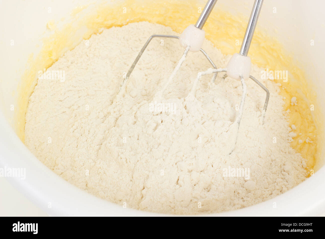 Flour and baking powder mixed into the dough Stock Photo Alamy