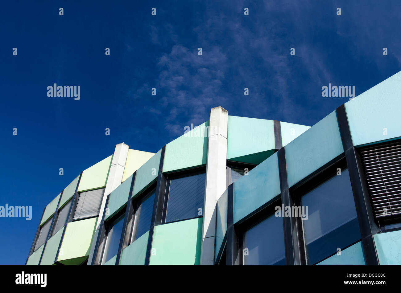 Modern building with windows and a blue sky Stock Photo - Alamy