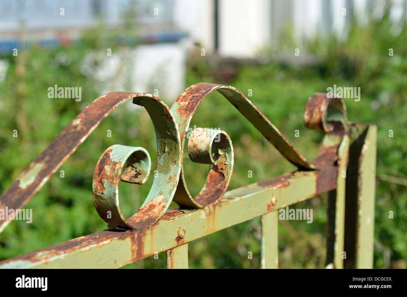 Old rusty green gate top Stock Photo - Alamy