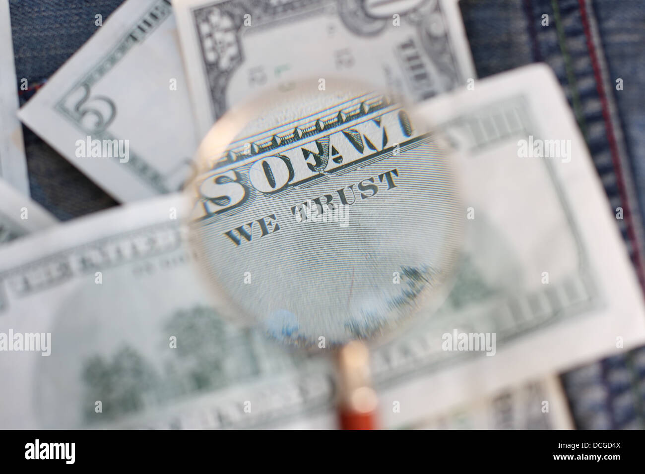 The back side of the banknote is under a magnifying glass Stock Photo