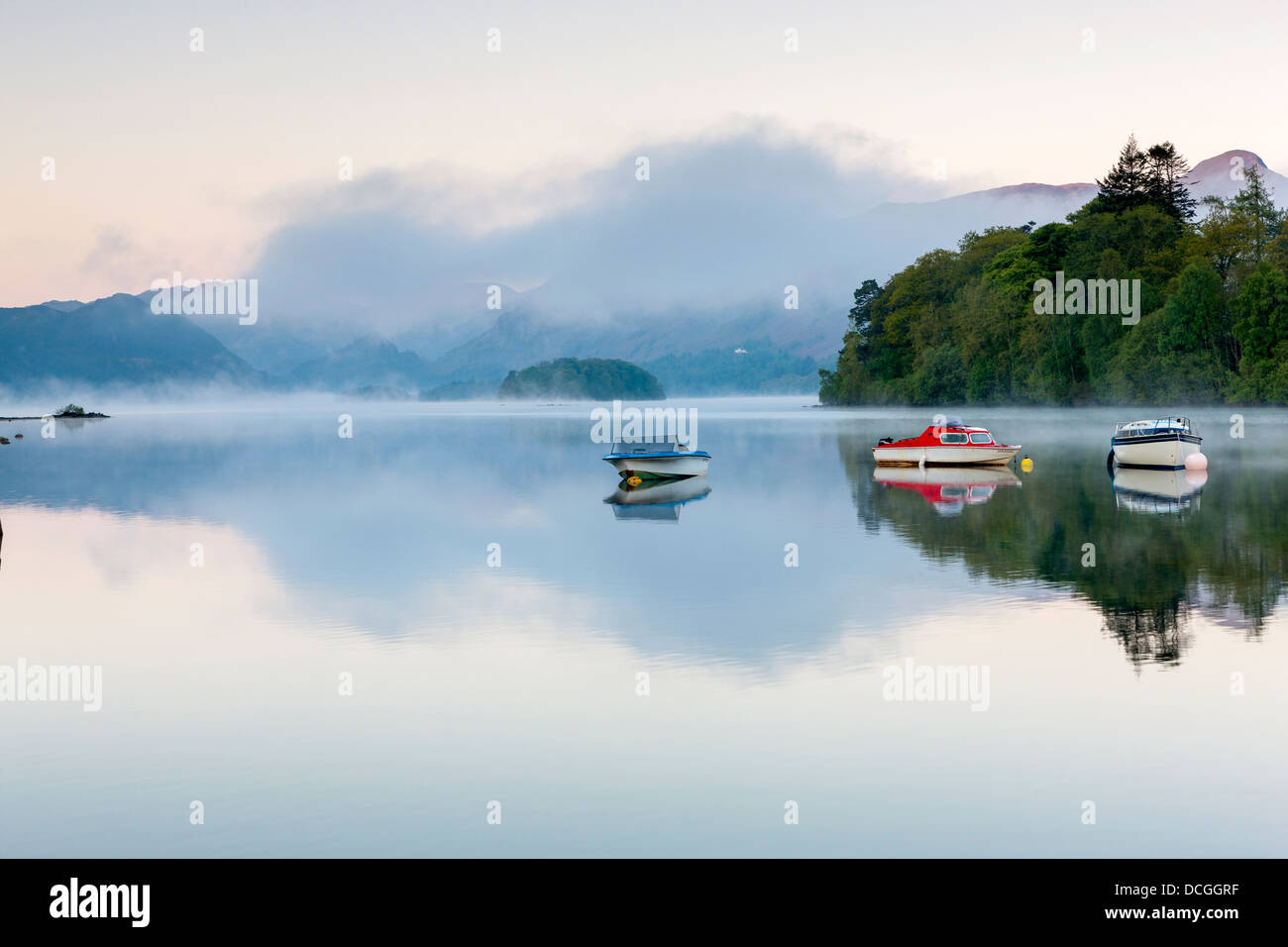 Boats on Derwent Water at sunrise, Keswick, Lake District National Park, Cumbria, England, UK, Europe. Stock Photo