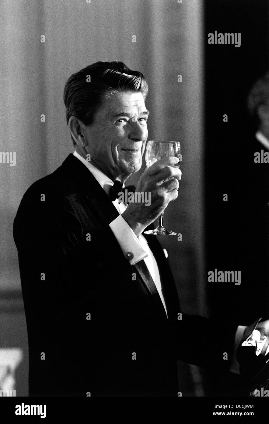 Digitally restored American history photo of President Ronald Reagan making a toast. Stock Photo