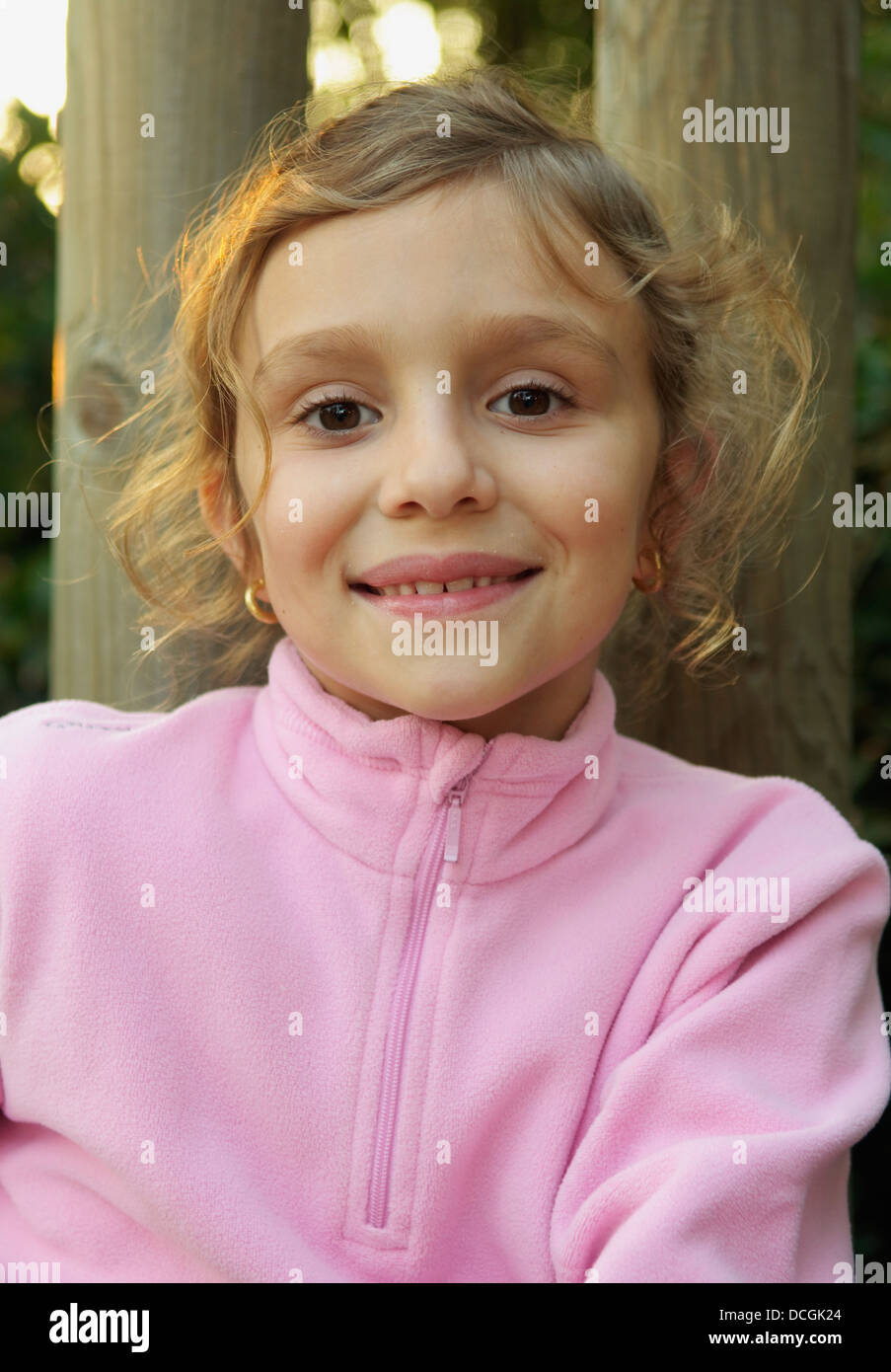 Portrait Of Girl Smiling Outdoors Stock Photo