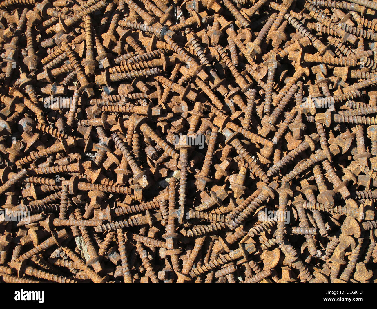 Rusty screws used for sleepers on railroad tracks Stock Photo Alamy