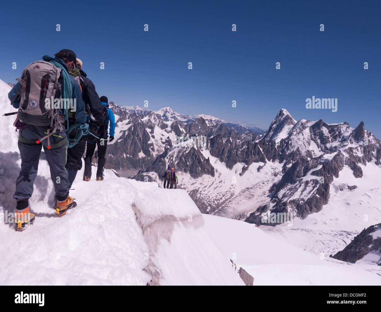 Aiguille du midi alpine walker leaving mountain station to head along ridge  and follow the knife edge trail Stock Photo - Alamy