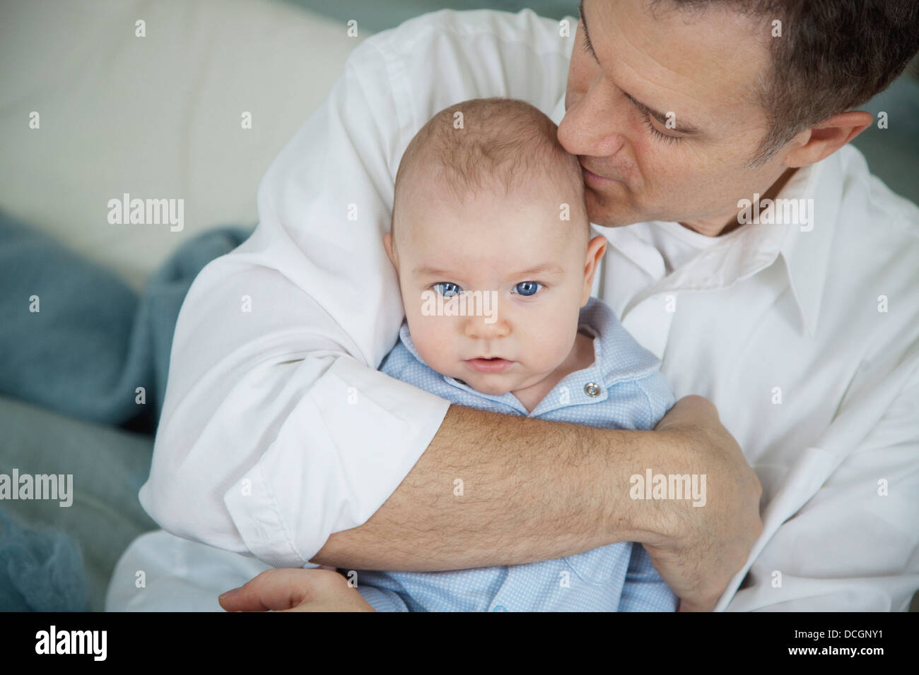 Father Hugging Baby Stock Photo