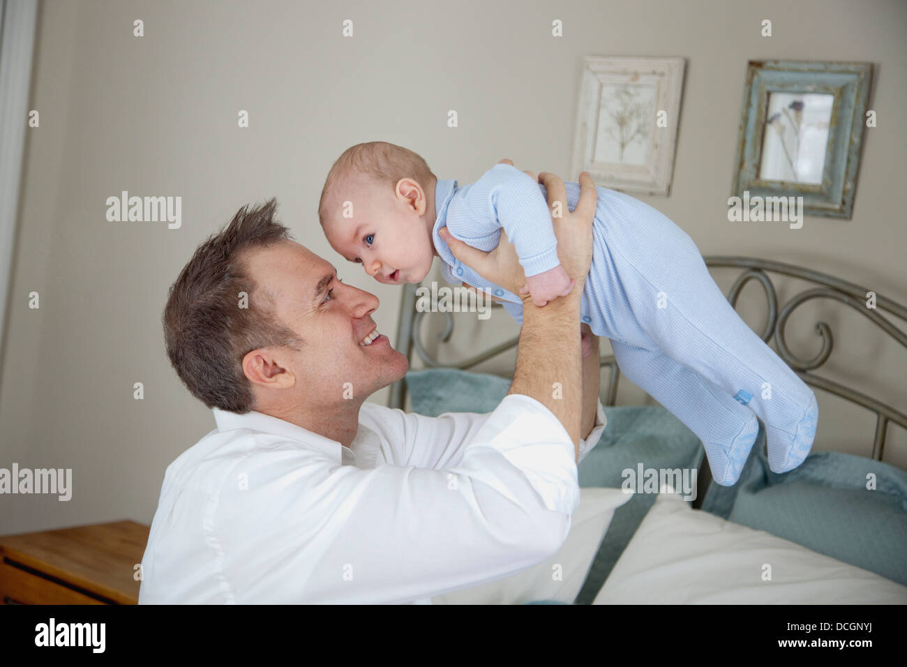 Father Playing With Baby Stock Photo