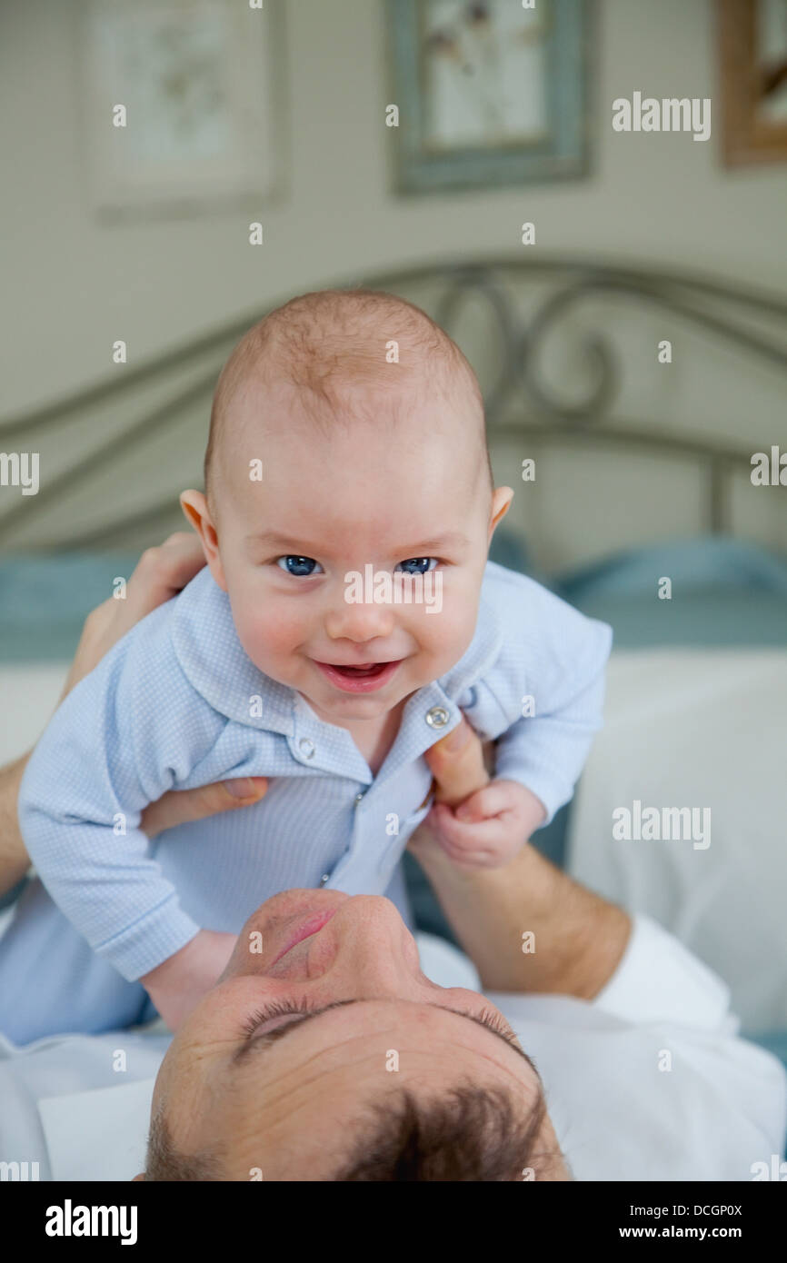 Father Holding Baby Stock Photo