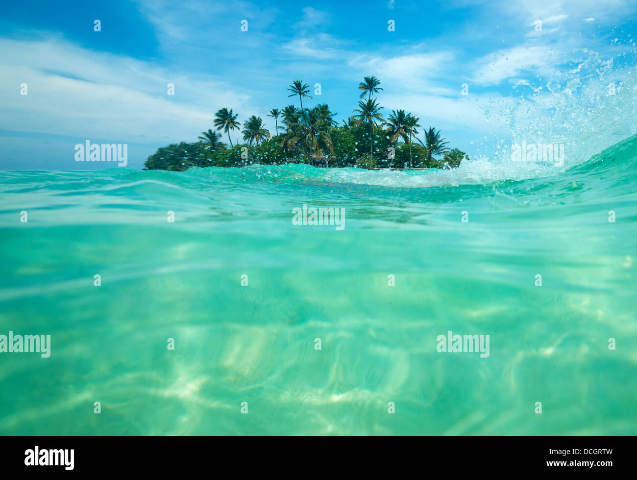 Tropical island in the ocean Stock Photo - Alamy