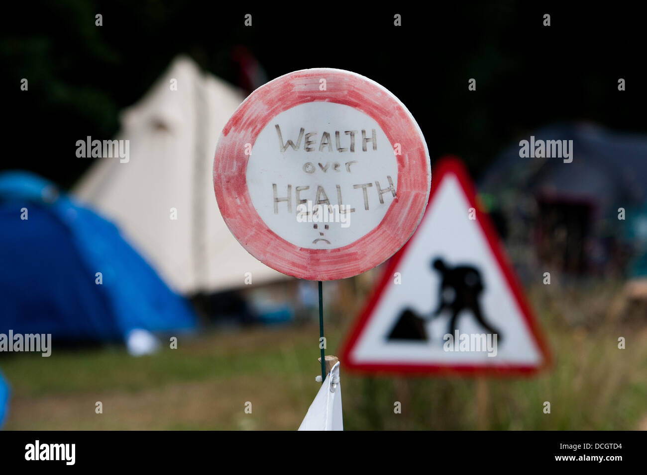 Balcombe, West Sussex, UK. 17th Aug, 2013. Wealth not health sign at protest against Cuadrilla drilling & fracking just outside the village of Balcombe in West Sussex. Credit:  martyn wheatley/Alamy Live News Stock Photo