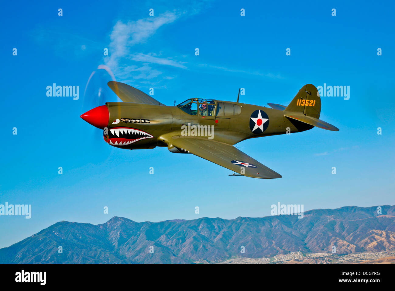 A Curtiss P-40E Warhawk in flight near Chino, California. Stock Photo
