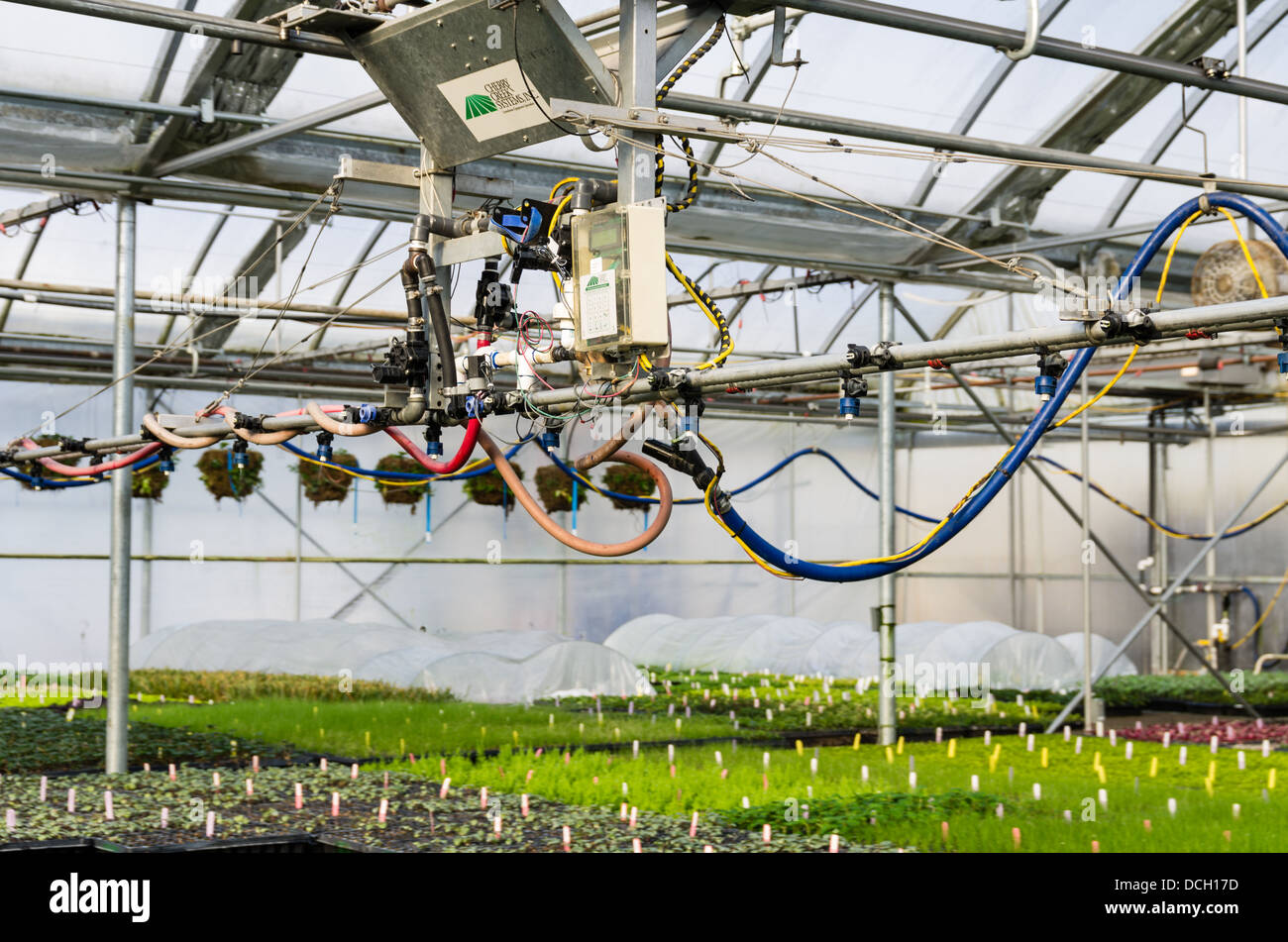 Boom irrigation system in a greenhouse to keep plants watered