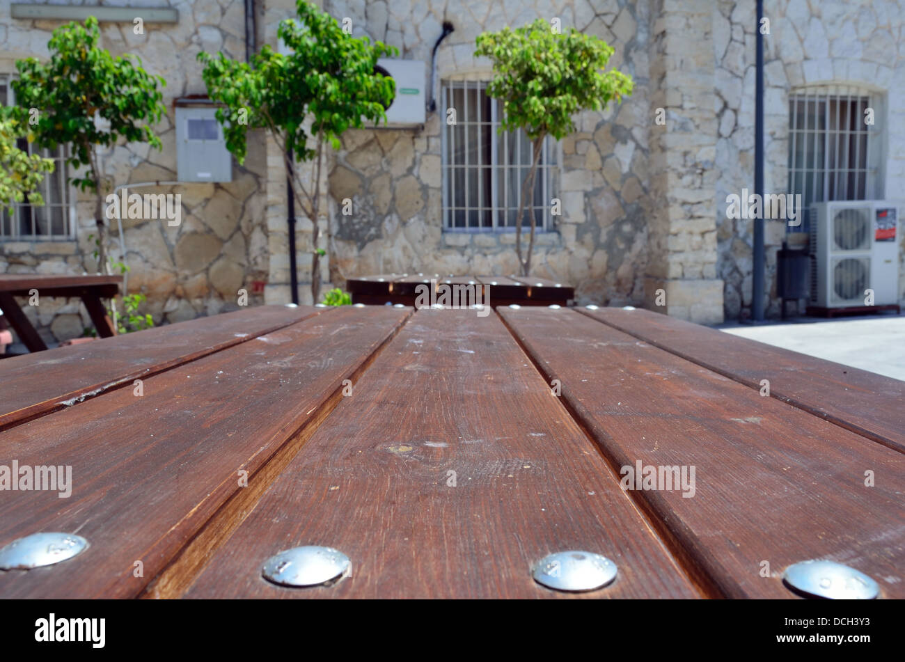 Wooden table and chairs in garden Stock Photo - Alamy