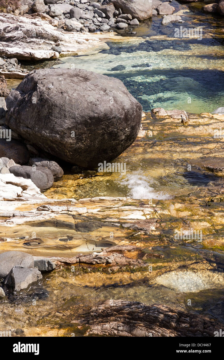 Stream and boulder in rocky white marble stream bed, Allt Aigeinn ...