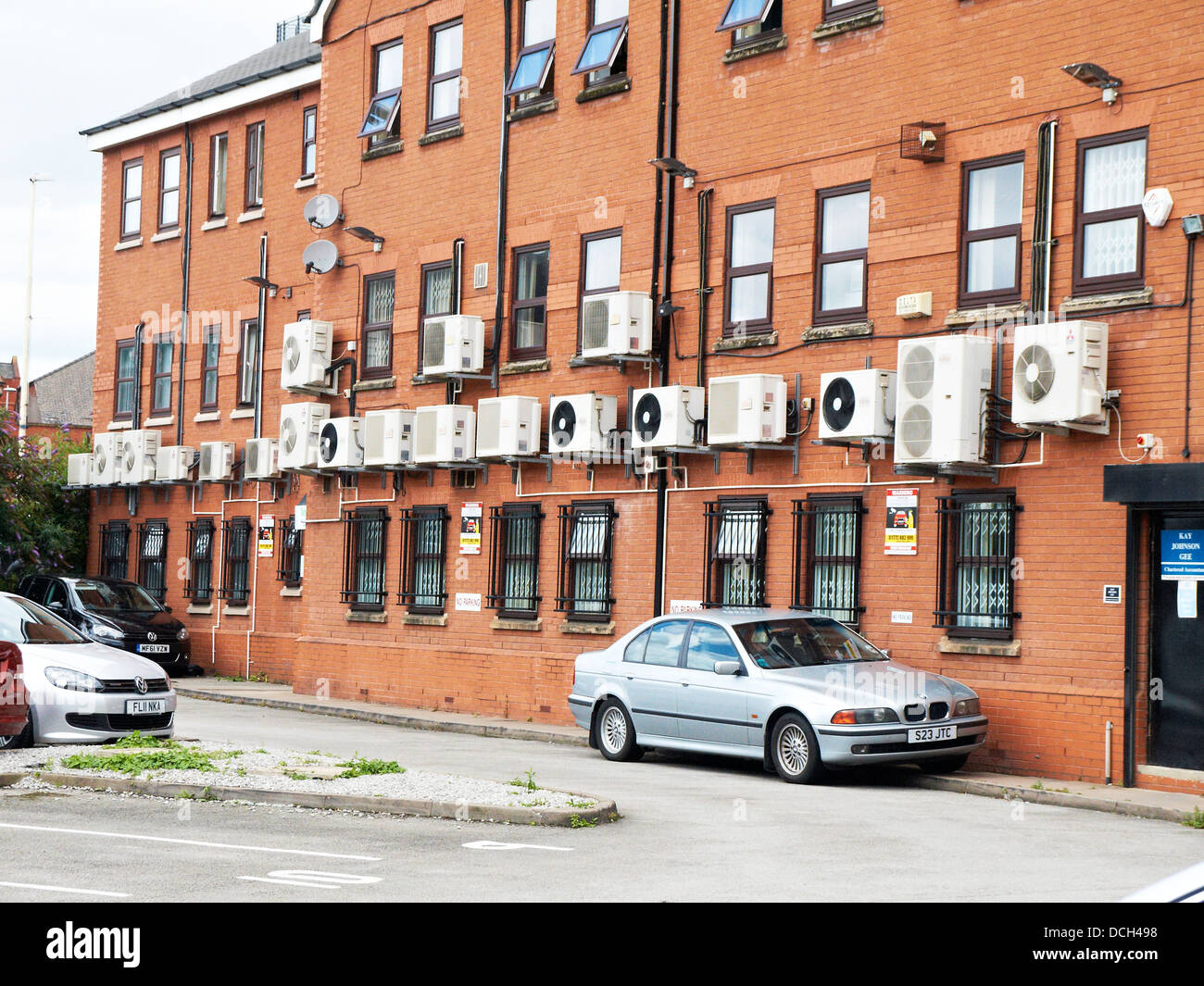Air conditioning units on side of office building in Manchester UK