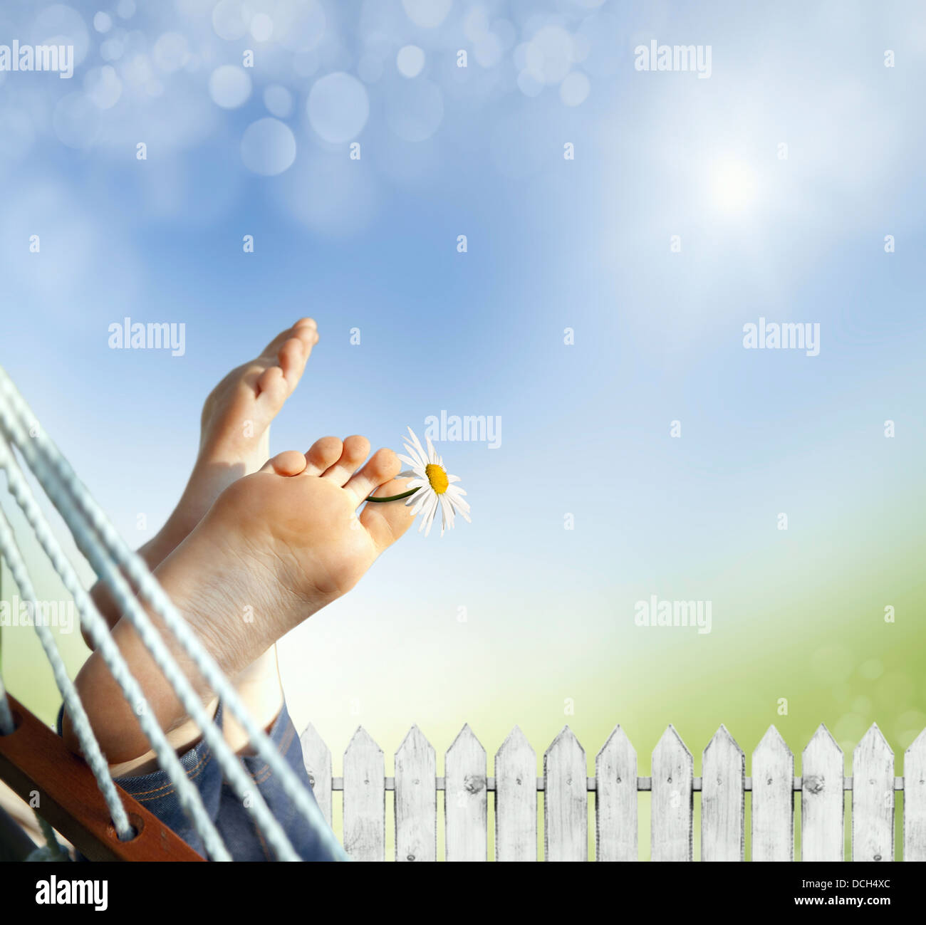 Relax in nature. Feet close up in a hammock Stock Photo