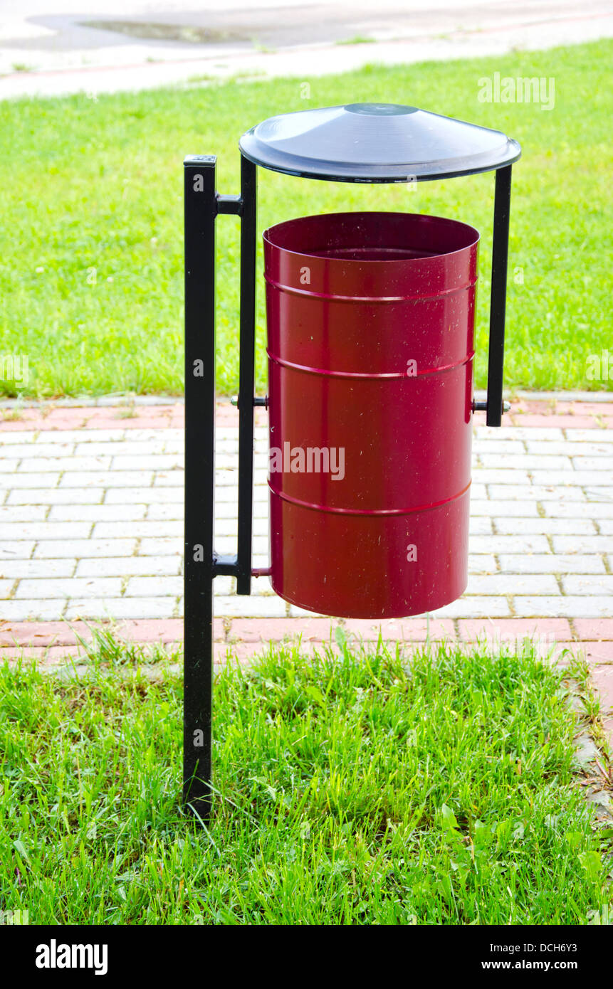 metallic garbage can in city park Stock Photo