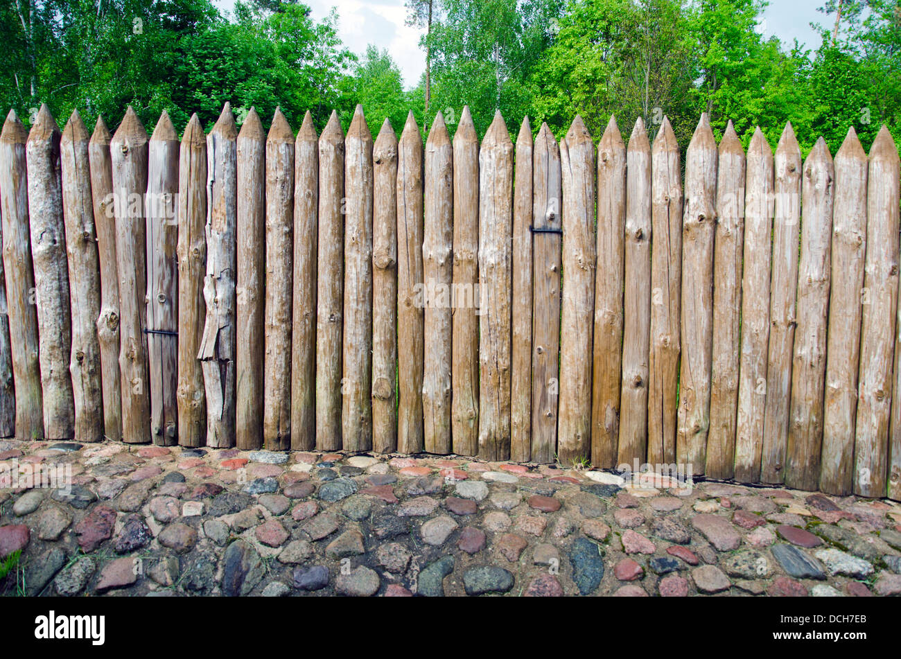 old wooden log fence in resort park Stock Photo