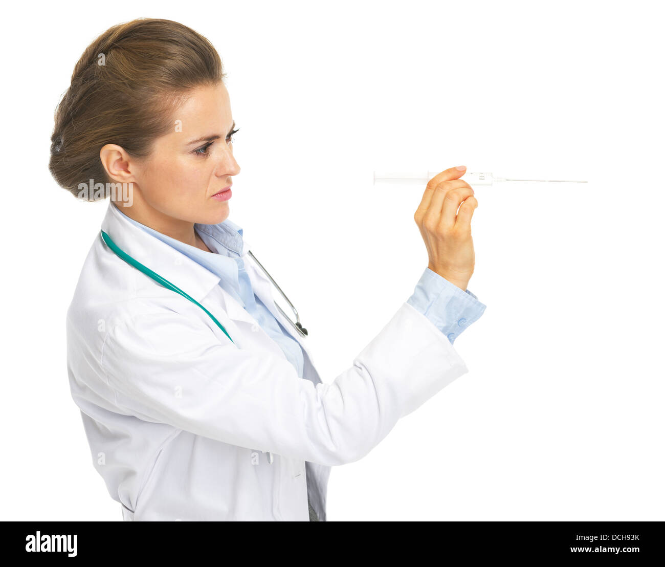Doctor woman using syringe as dart Stock Photo - Alamy