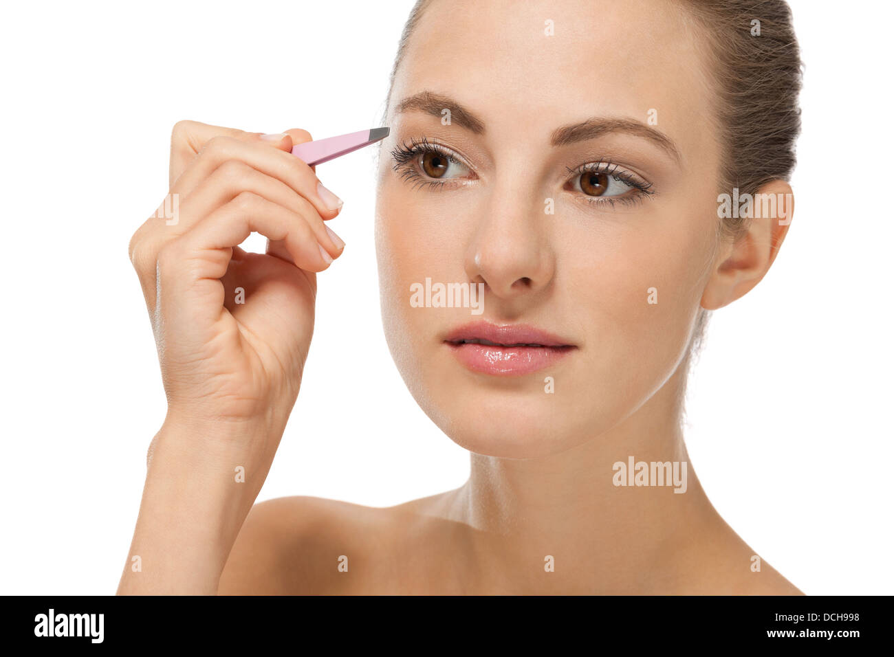 beautiful young woman and eyebrow tweezers isolated on white Stock