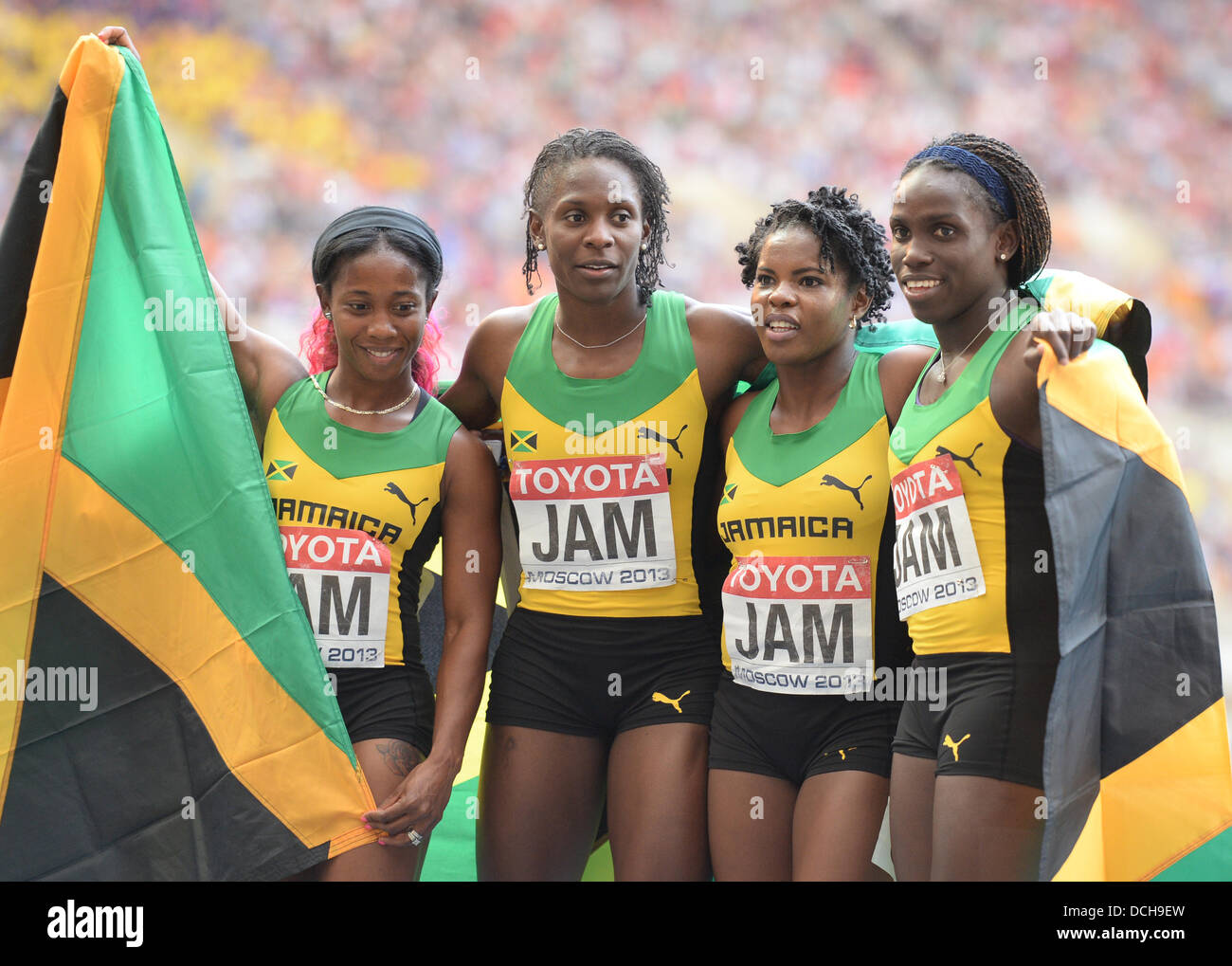 (L-R) Shelly-Ann Fraser-Pryce, Kerron Stewart, Schillonie Calvert and Carrie Russell of Jamaica celebrate after winning the women's 4x100m relay final at the 14th IAAF World Championships in Athletics at Luzhniki Stadium in Moscow, Russia, 18 August 2013. Photo: Bernd Thissen/dpa +++(c) dpa - Bildfunk+++ Stock Photo