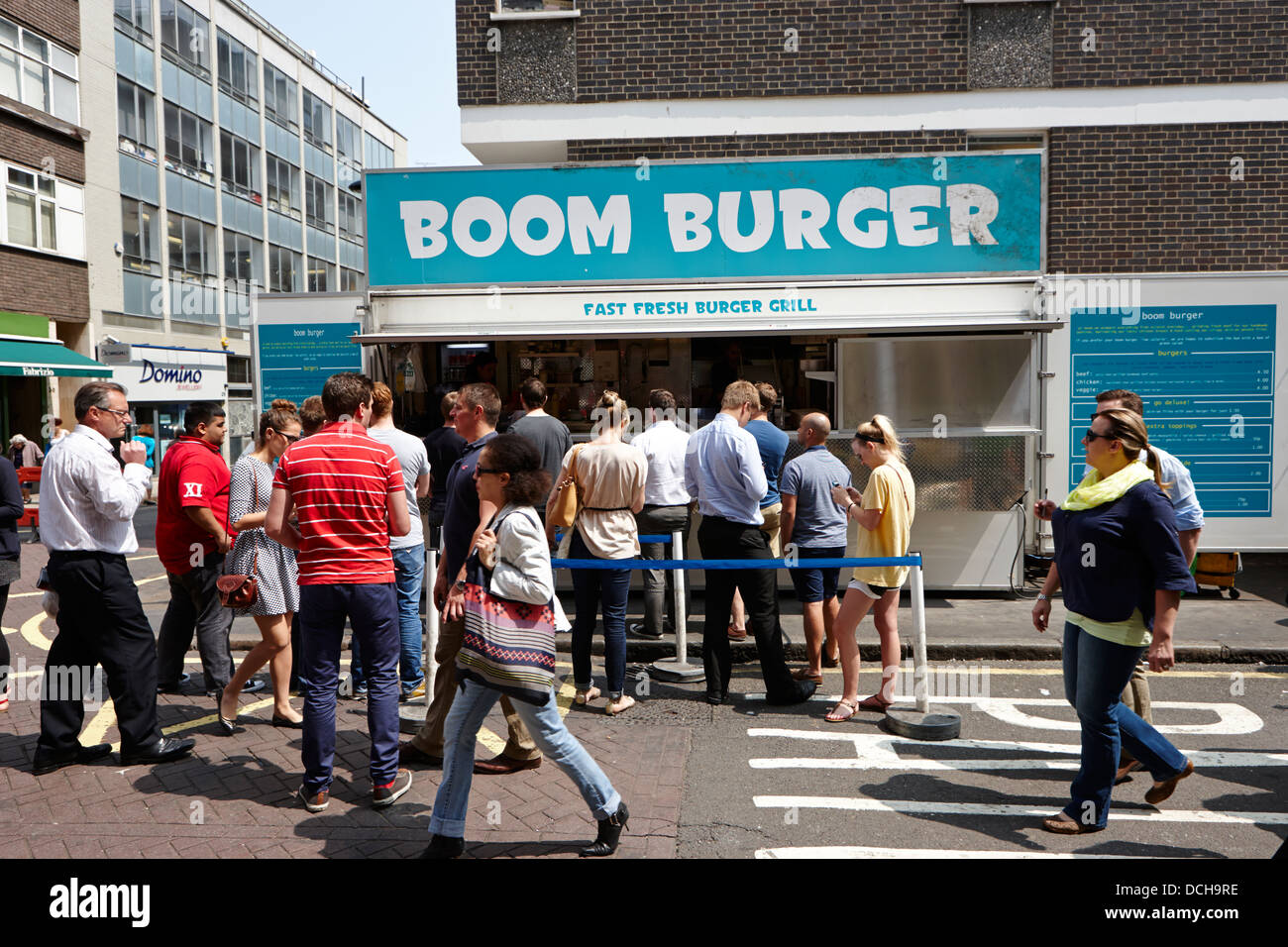 fast food burger stand at leather lane market at lunchtime London England UK Stock Photo