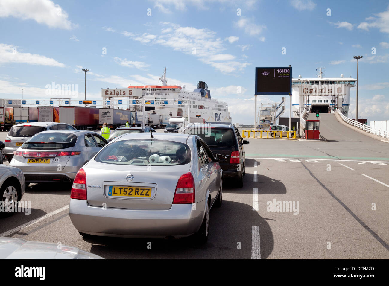 Cars waiting to board the car ferry for the channel crossing, at Calais harbour, Calais to Dover route, France Europe Stock Photo