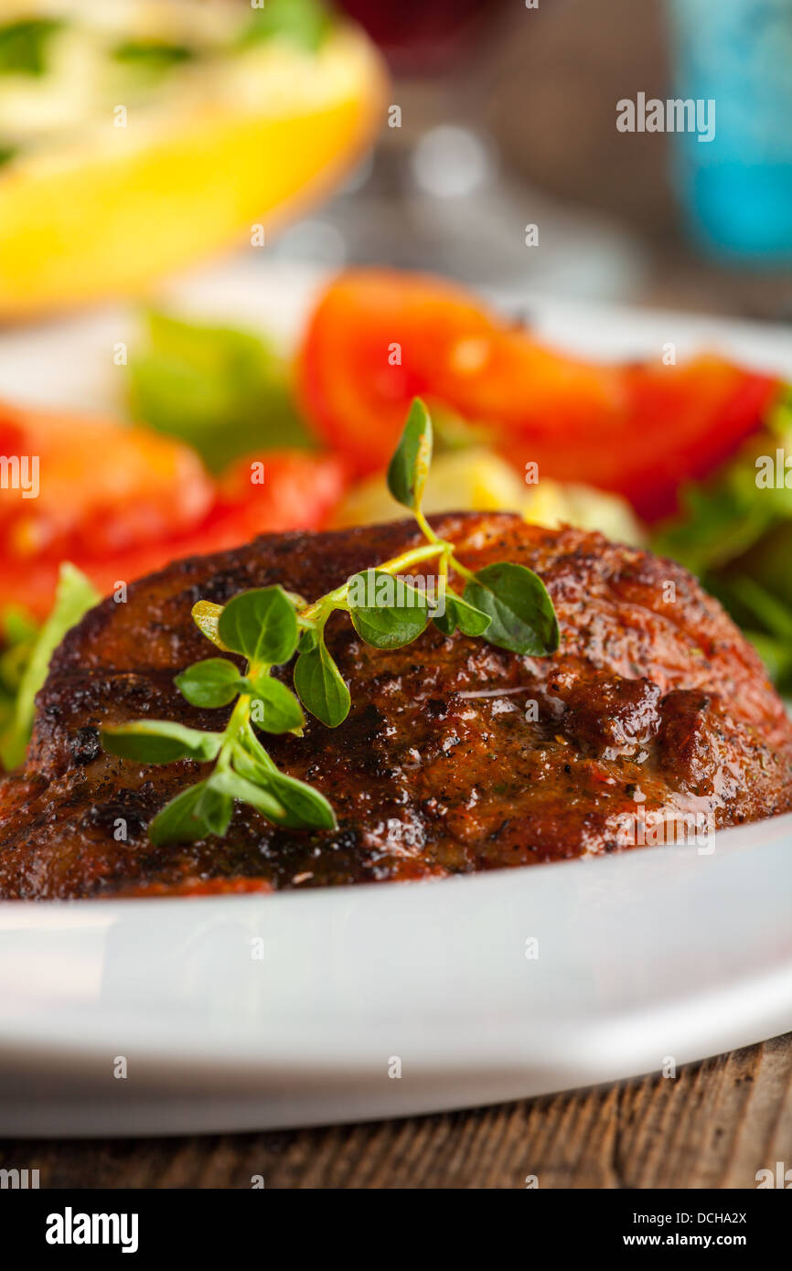 grilled steak with oregano Stock Photo Alamy