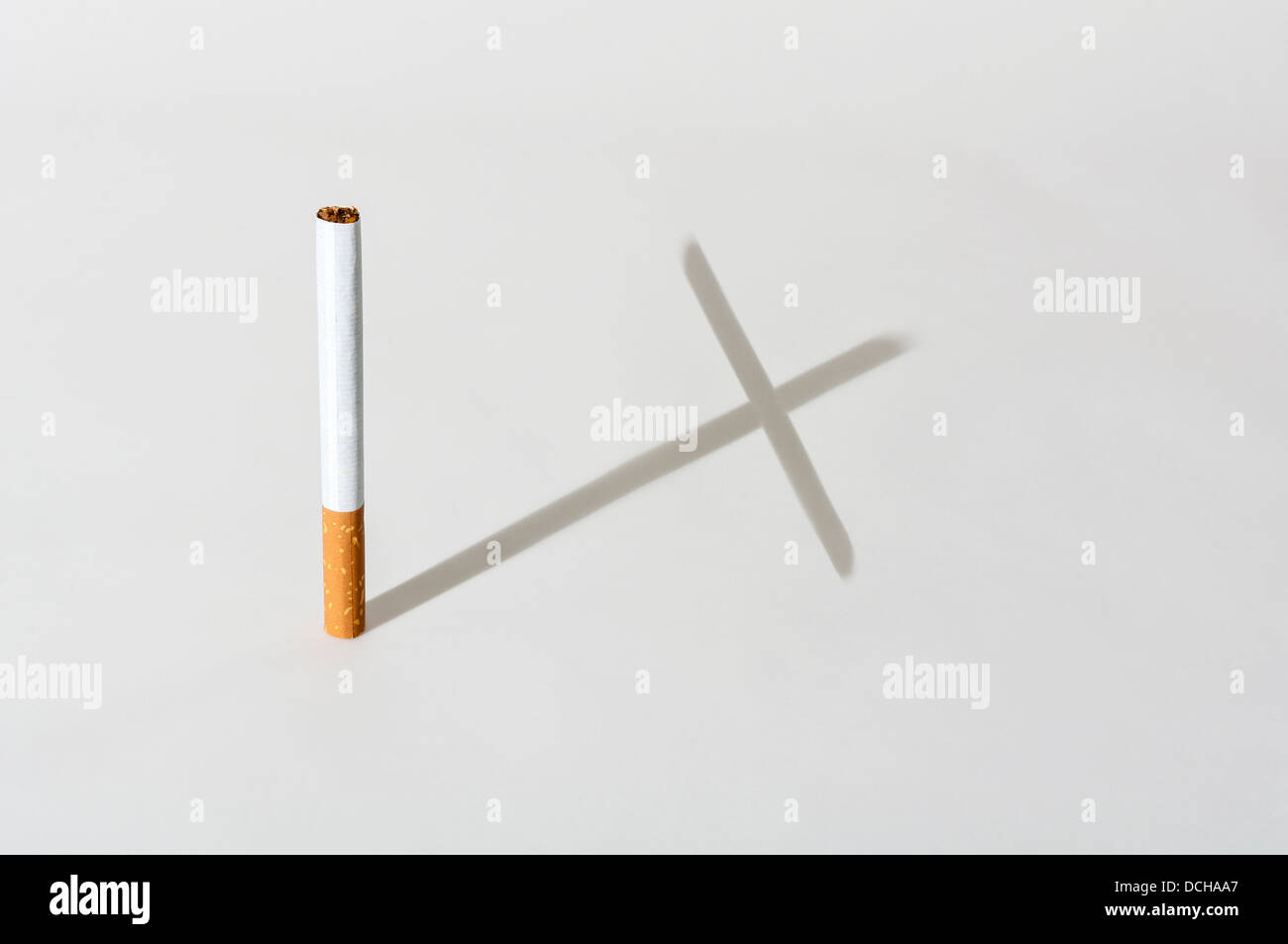 Smoking kills cigarette cross shaped shadow Stock Photo