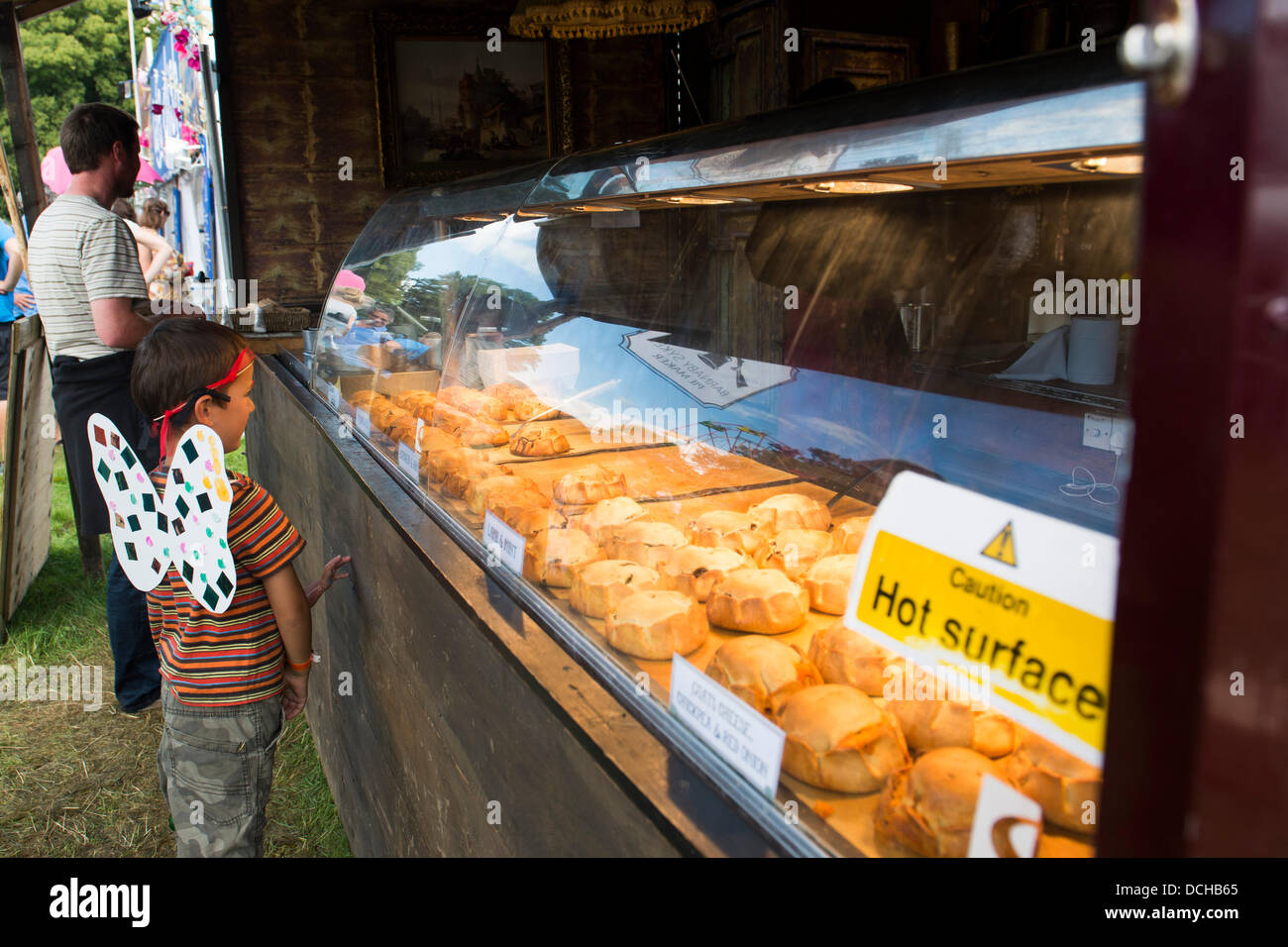 Crickhowell, Wales, UK. 18th August 2013. Day four of Green Man Festival. A young child looks at some of the food on offer. Credit:  Polly Thomas/Alamy Live News Stock Photo