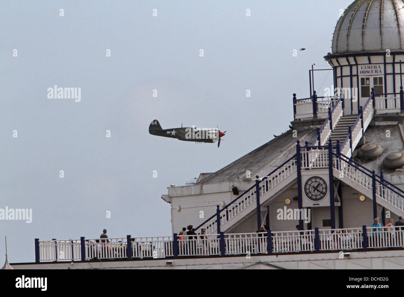 Eastbourne, UK.18th Aug, 2013. SWIP team plane flies over the pier in the sunshine during the Aibourne air display in Eastbourn Credit: Keith Larby/Alamy live News Stock Photo