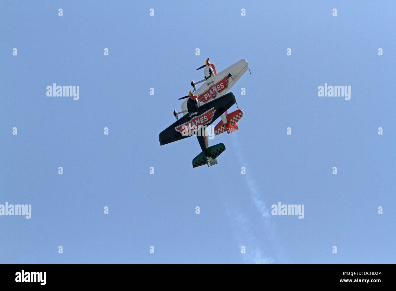 Eastbourne, UK.18th Aug, 2013. The Disney planes with the Matadors fly along the seafront in the sunshine during the Aibourne air display in Eastbourn Credit: Keith Larby/Alamy live News Stock Photo